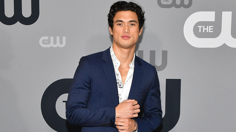 Charles Melton posing at an event