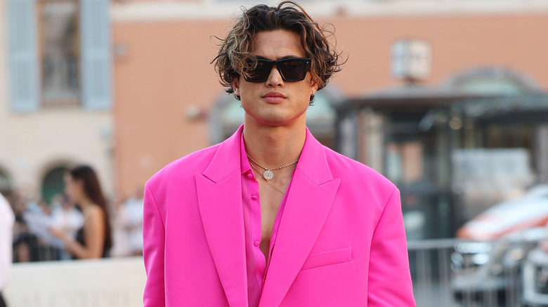 Charles Melton arriving at a fashion show