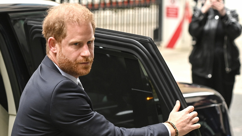 Prince Harry exiting a car