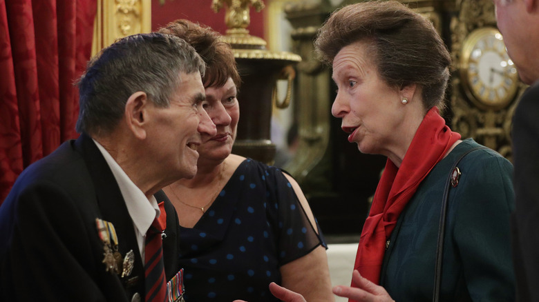 Princess Anne in red scarf