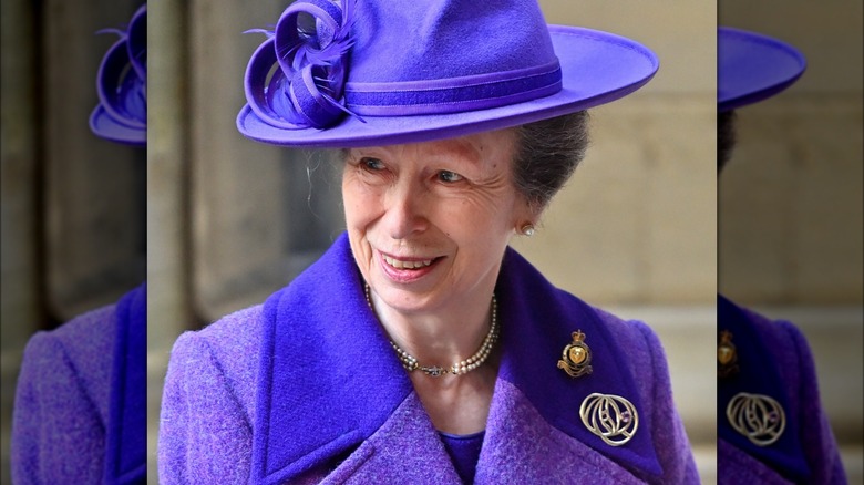 Princess Anne in a purple hat 