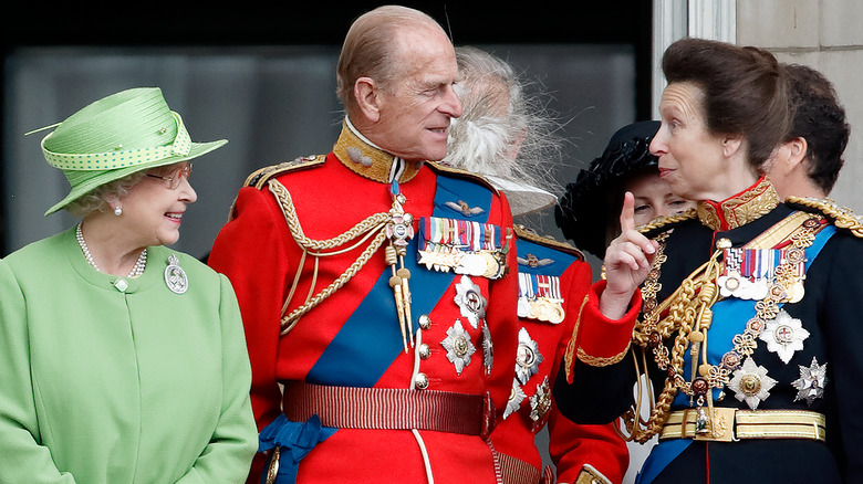 Queen Elizabeth, Prince Phillip, and Princess Anne talking