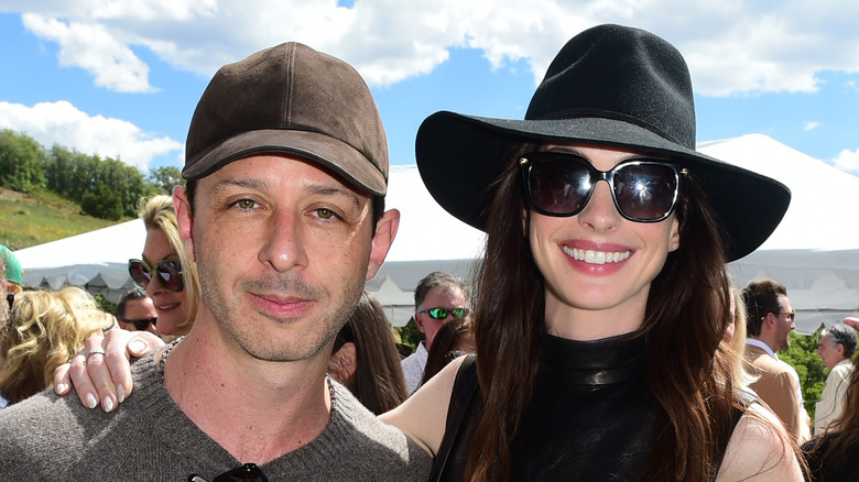 Jeremy Strong and Anne Hathaway smiling