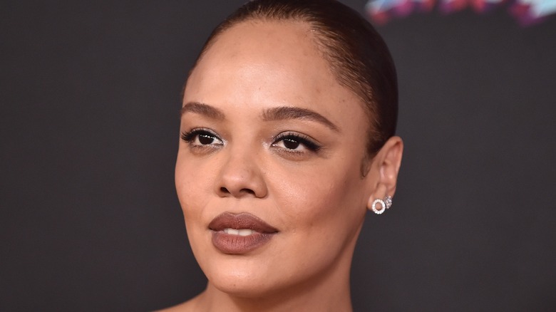 Tessa Thompson smiles on the red carpet