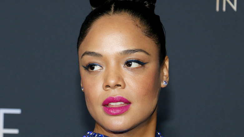 Tessa Thompson smiles on the red carpet