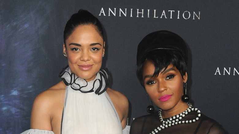 Tessa Thompson and Janelle Monáe smiling on the red carpet