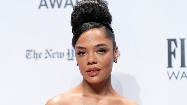 Tessa Thompson poses on the red carpet