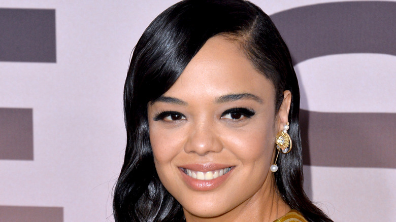 Tessa Thompson smiles on the red carpet