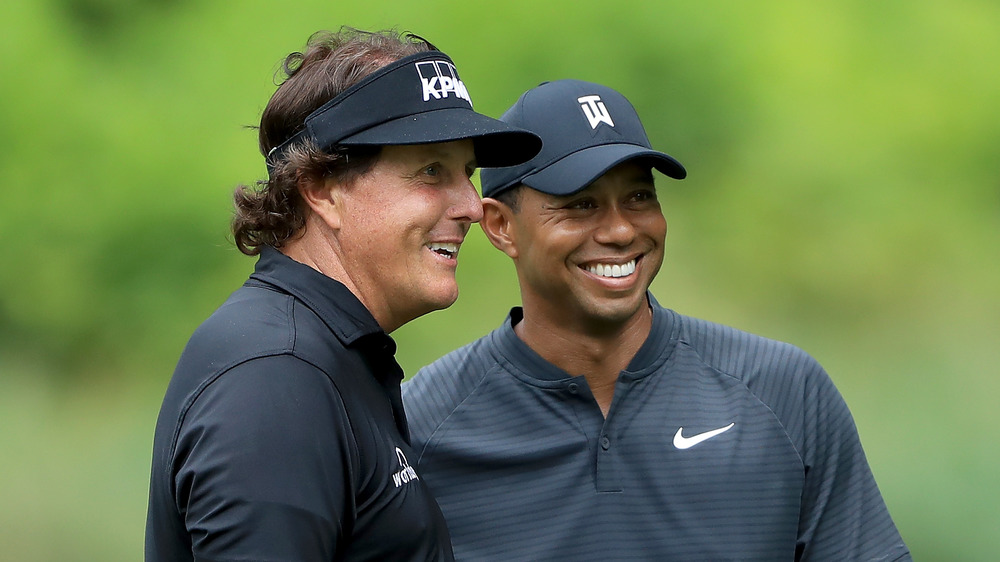 Phil Mickelson and Tiger Woods smiling together