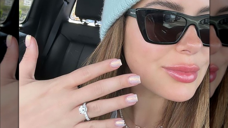 Brielle Biermann taking selfie showing off diamond ring