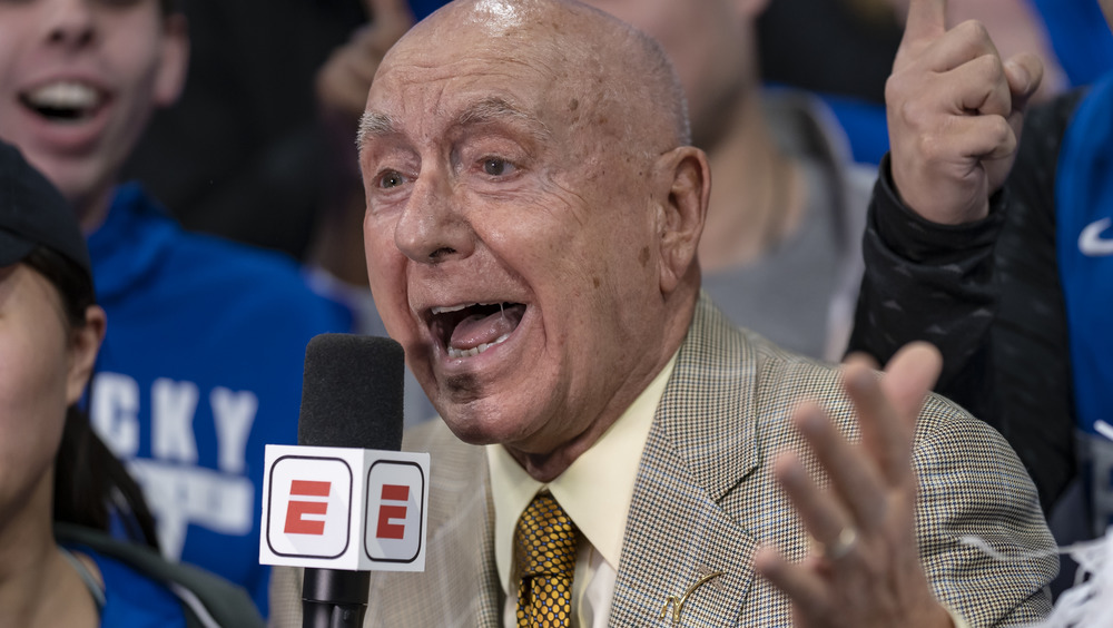 ESPN sportscaster Dick Vitale excitedly talking into a microphone