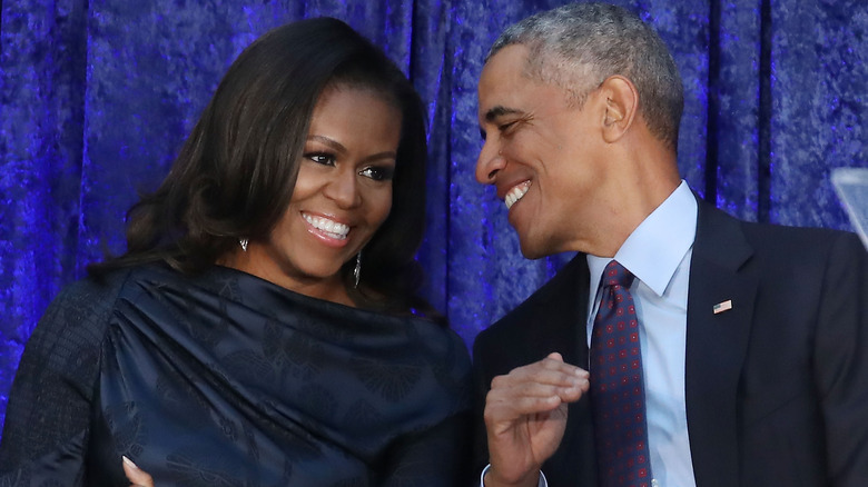 Barack and Michelle Obama laughing