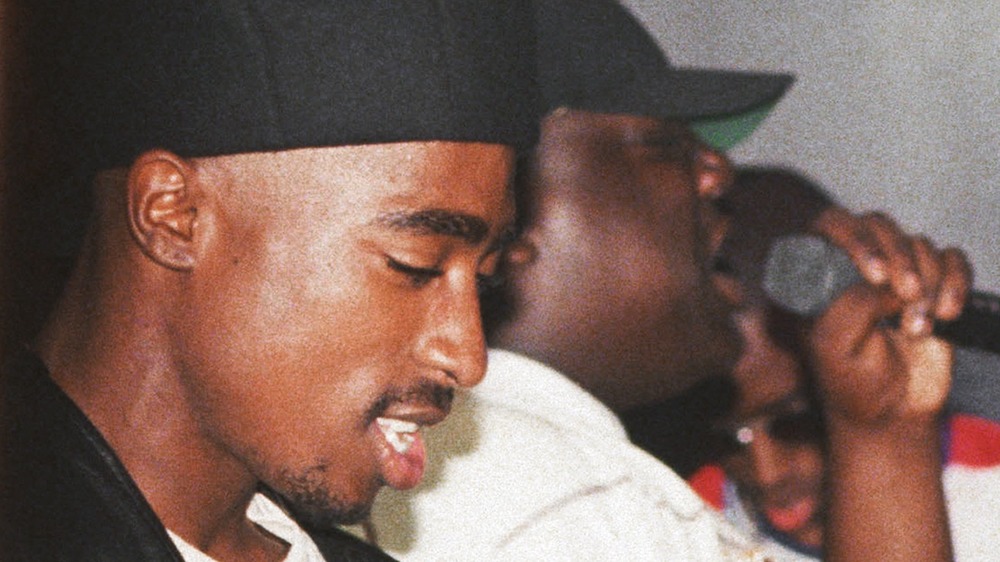 Tupac Shakur pictured with Biggie Smalls on stage in the 90s