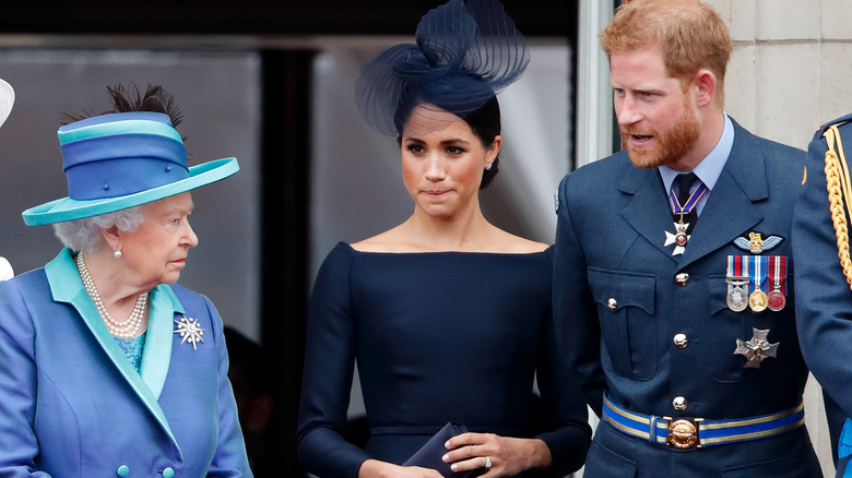 Queen Elizabeth with Meghan Markle and Prince Harry