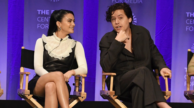 Camila Mendes and Cole Sprouse talking