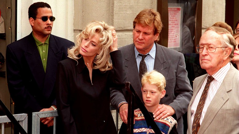 Farrah Fawcett stands with Ryan and Redmond O'Neal