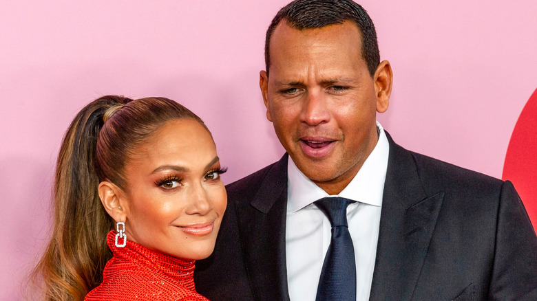 Jennifer Lopez and Alex Rodriguez smiling on the red carpet