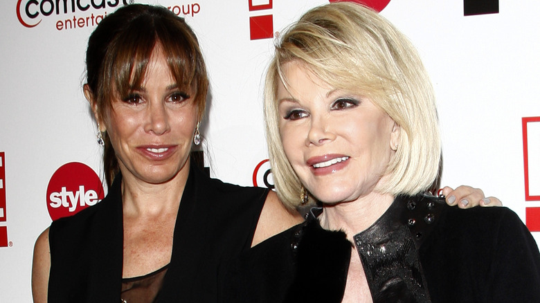 Melissa Rivers puts her hand around Joan Rivers 