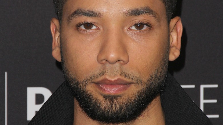 Jussie Smollett grimaces for the cameras