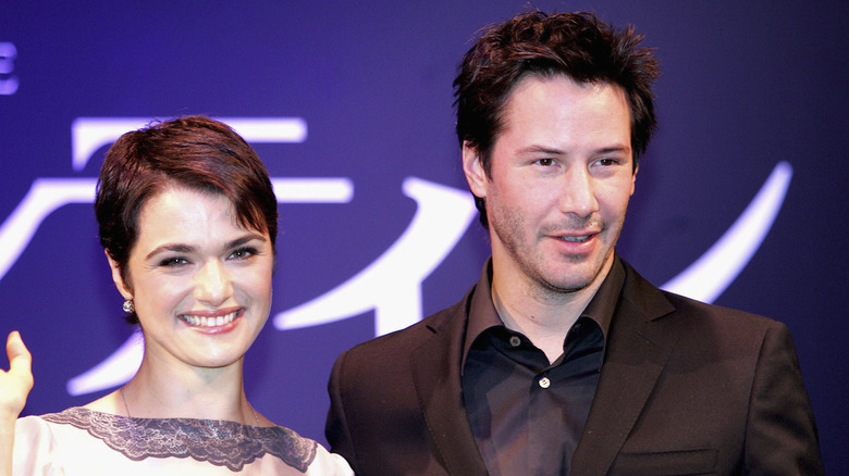 Rachel Weisz and Keanu Reeves pose side by side in 2005