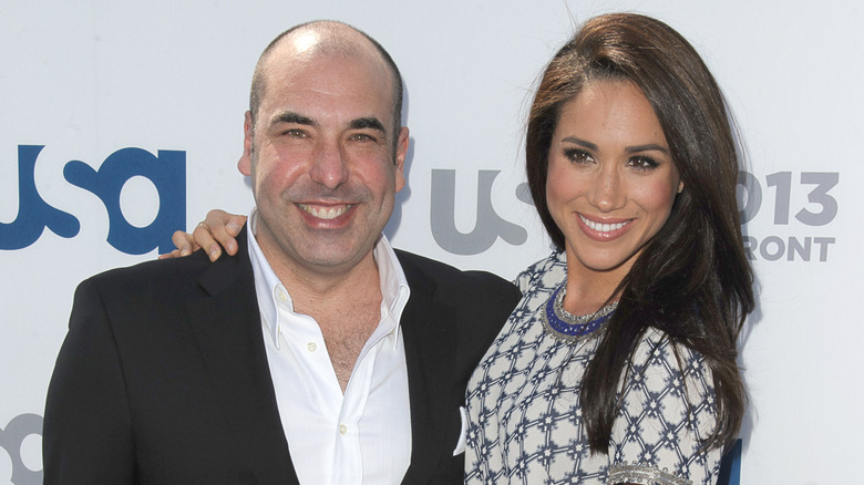 Rick Hoffman and Meghan Markle smiling