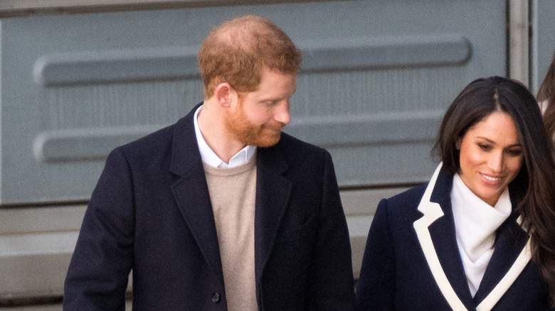 Prince Harry and Meghan Markle walking