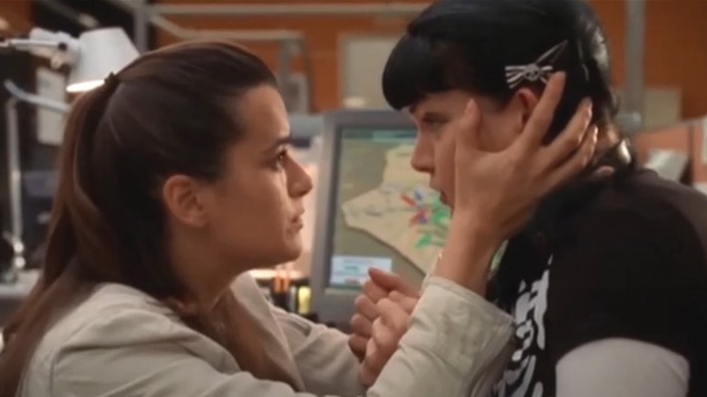 Cote de Pablo grabbing Pauley Perrette's face