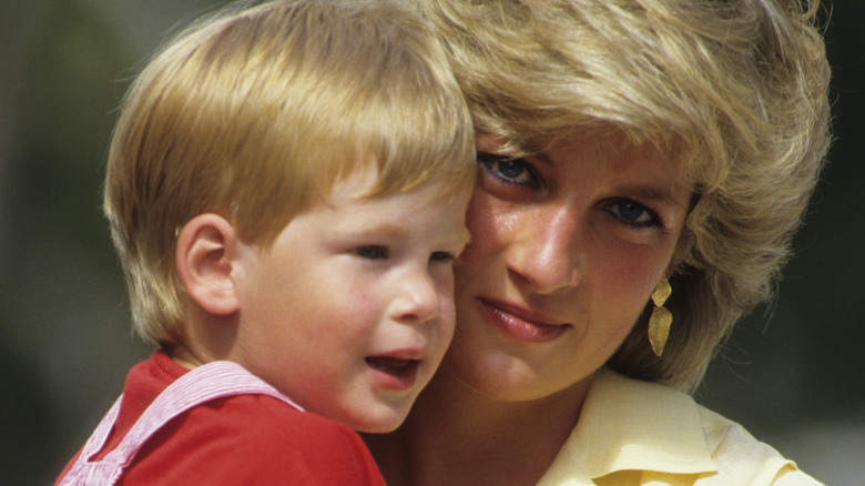 Princess Diana carrying Prince Harry in the 1990s