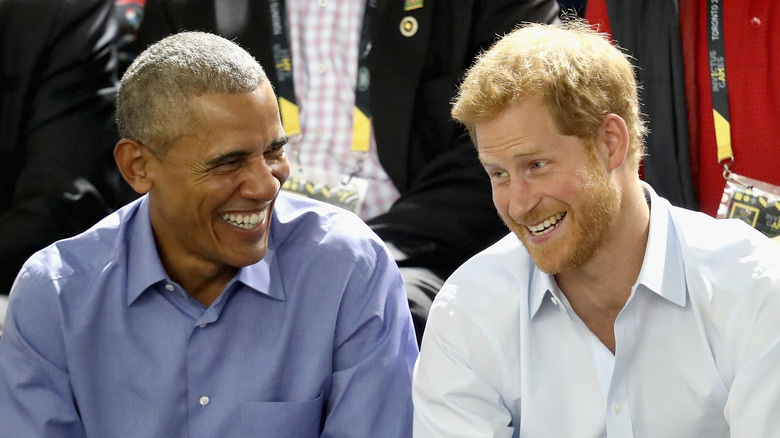 Barack Obama laughing with Prince Harry