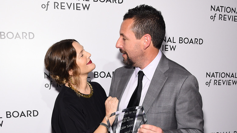 Drew Barrymore and Adam Sandler smiling