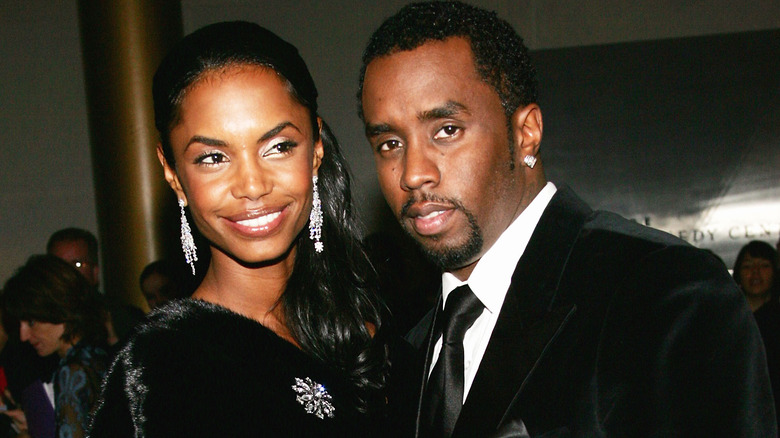 Sean "P. Diddy" Combs and Kim Porter posing