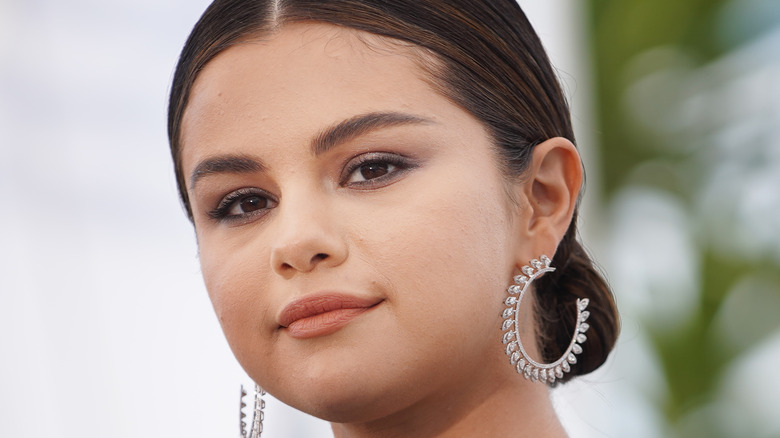 Selena Gomez wearing earrings