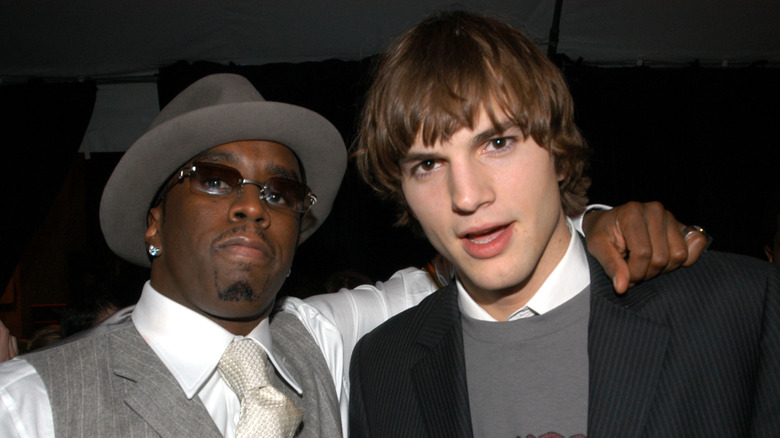 Diddy arm around Ashton Kutcher