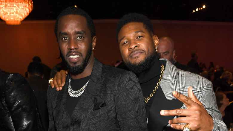 Usher with arm around Diddy