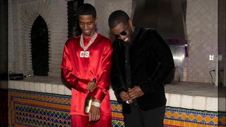 Christian Combs standing with Diddy