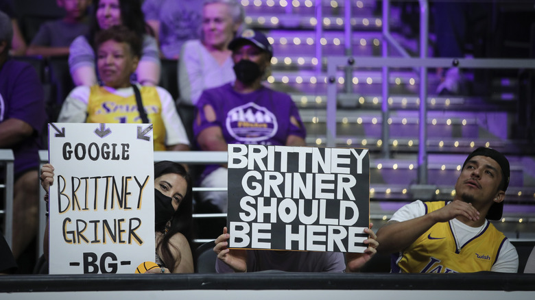 Brittney Griner supports hold signs