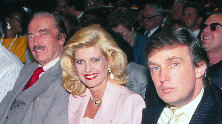 Fred Trump sitting in an audience with Ivana and Donald Trump