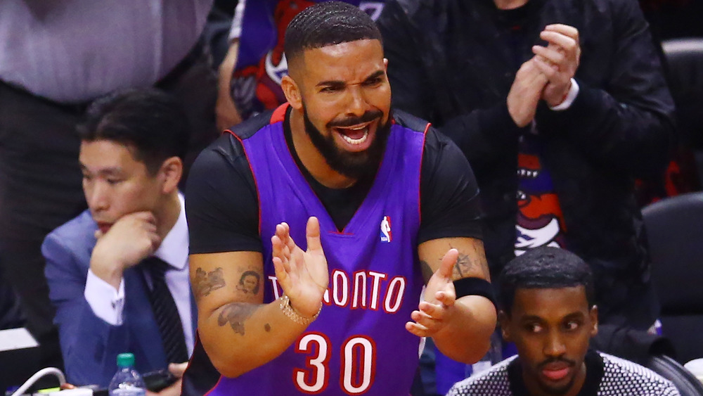 Drake cheering at Toronto Raptors game