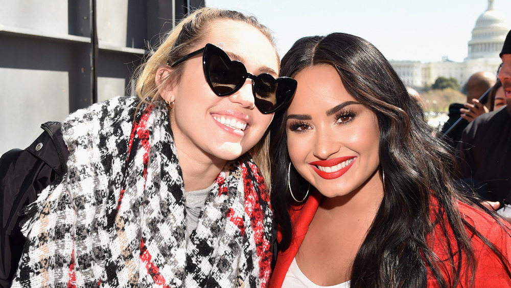 Miley Cyrus and Demi Lovato smiling