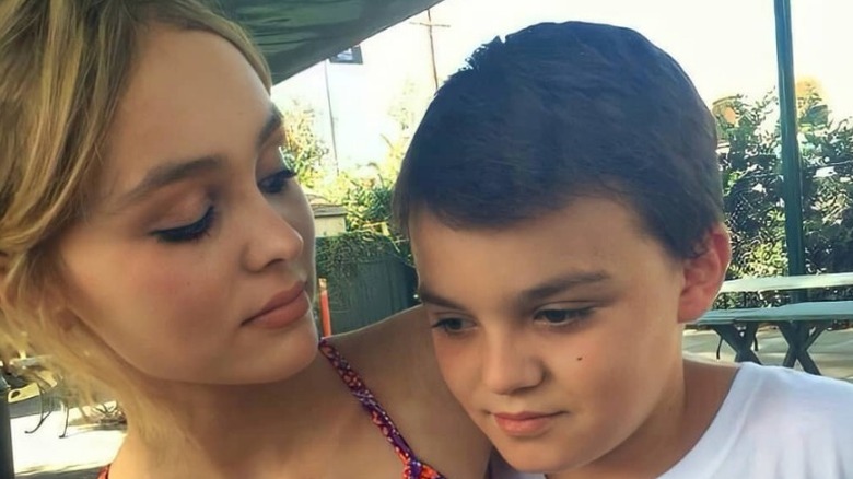 Lily-Rose Depp holding little brother Jack Depp