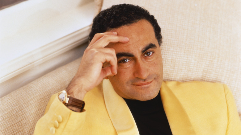 Dodi Fayed hand on forehead