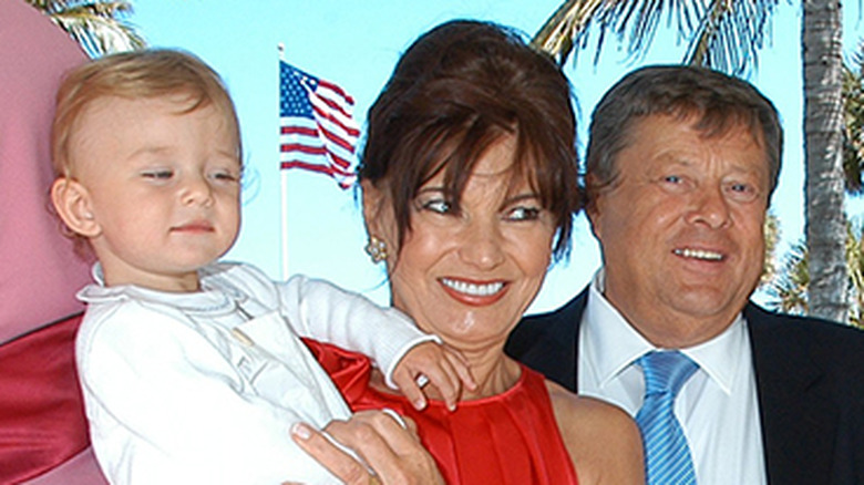 Amilija and Viktor Knavs holding baby Barron Trump