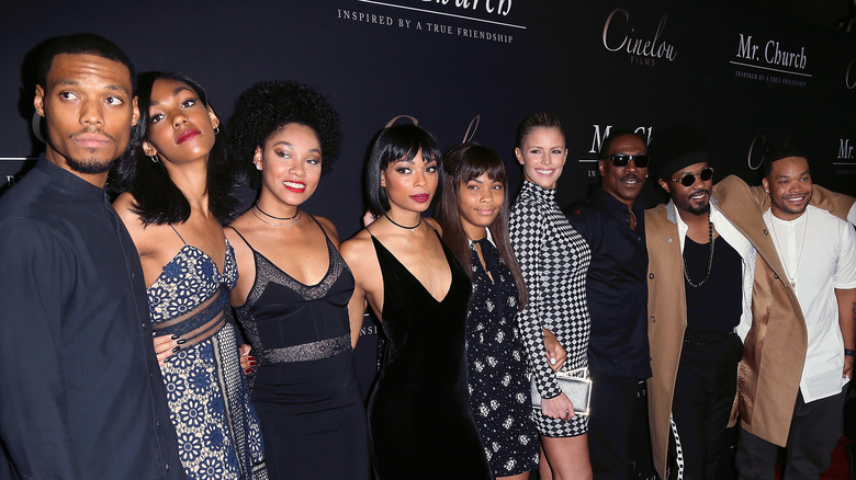 Eddie Murphy poses with his fiancee and seven of his children