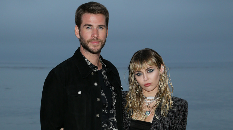 Miley Cyrus and Liam Hemsworth pose