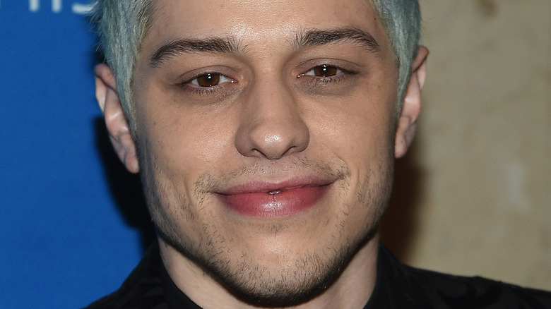 Pete Davidson poses with blue hair