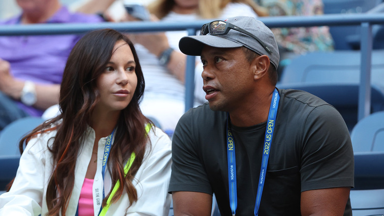 Erica Herman and Tiger Woods talking