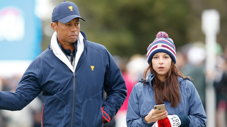 Tiger Woods and Erica Herman walking