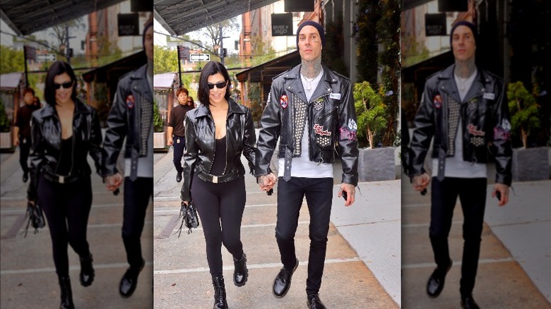 Travis Barker and Kourtney Kardashian hold hands