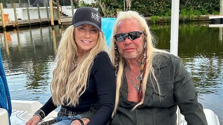 Francie Frane and Duane Chapman posing on lake