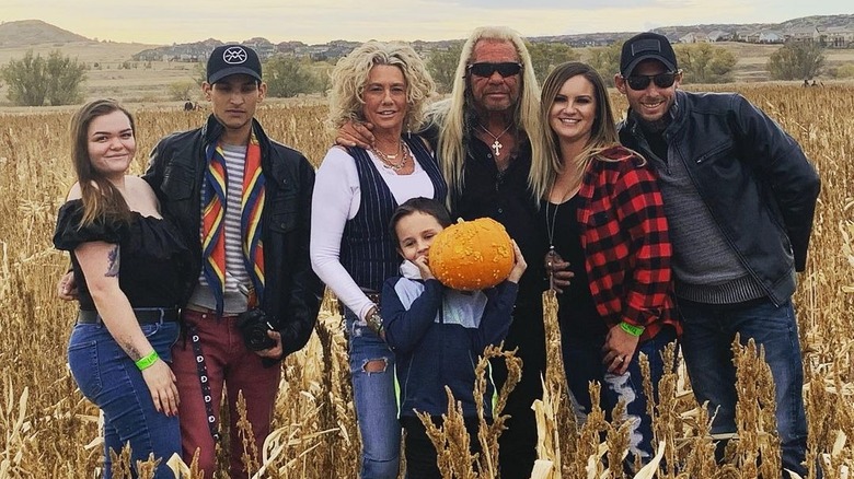 Francie Frane and family posing on field